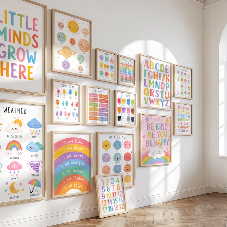 May include: A collection of framed educational posters with colorful illustrations and text. The posters cover topics like the alphabet, numbers, weather, feelings, and affirmations. The frames are a light wood color, and the overall aesthetic is bright and cheerful.