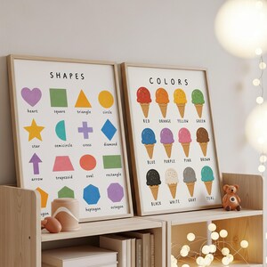 May include: Two framed educational prints. One displays colorful shapes with labels like "heart" and "square." The other shows ice cream cones in various colors, labeled "red," "orange," and more. The prints are in wooden frames.