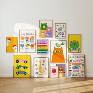 May include: A collection of framed art prints with colorful illustrations. The prints feature various themes, including animals, inspirational quotes, and positive affirmations. The text "daily reminders", "BE YOU", and "WE'RE DIFFERENT AND IT'S TOTALLY COOL!" are visible.