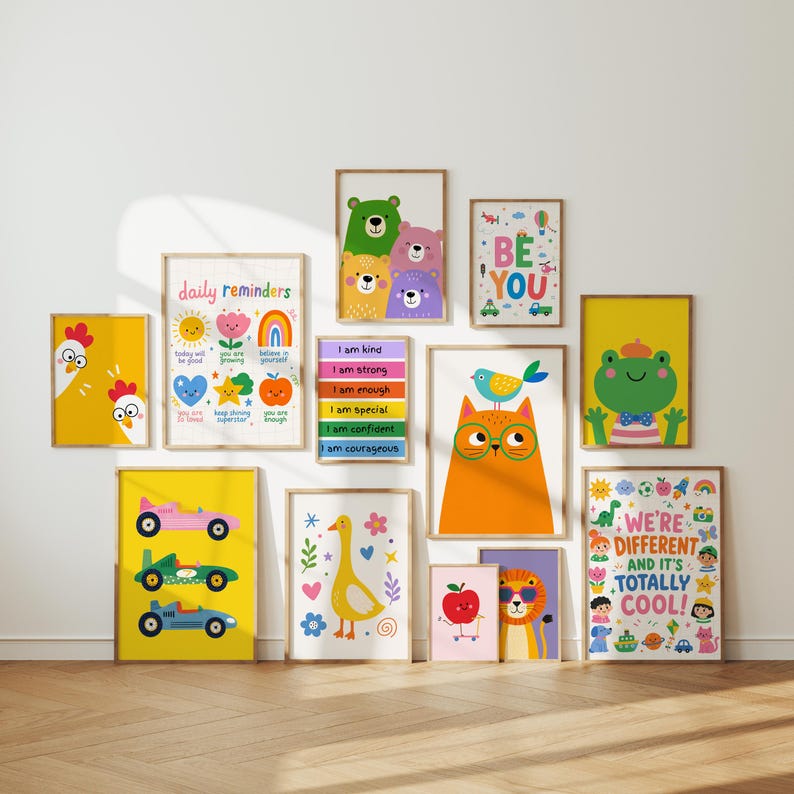May include: A collection of framed art prints with colorful illustrations. The prints feature various themes, including animals, inspirational quotes, and positive affirmations. The text "daily reminders", "BE YOU", and "WE'RE DIFFERENT AND IT'S TOTALLY COOL!" are visible.