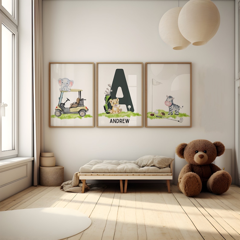 May include: Three framed prints with a golf theme. The first print features an elephant in a golf cart, the second print features a lion in a golf bag with the letter A and the name Andrew, and the third print features a zebra with a golf club.