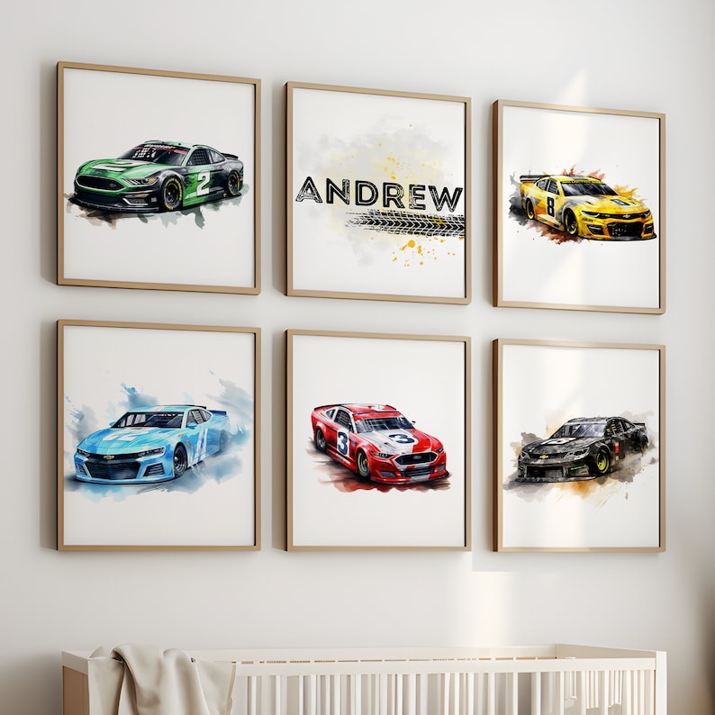 May include: Six framed prints of watercolor paintings of race cars. The prints feature different colored cars with numbers on the side. One print has the name "ANDREW" in black text with a tire track design.