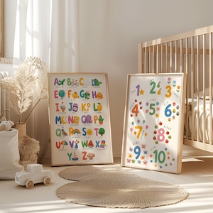 May include: Two framed educational prints. One features the alphabet with colorful illustrations, and the other displays numbers one through ten with corresponding images. The prints are in wooden frames, suitable for a child's room.