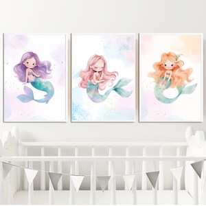 May include: Three watercolor paintings of mermaids with different colored hair and tails. The mermaids are sitting on a cloud-like background with a light blue, pink, and yellow color scheme.