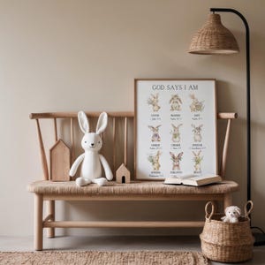 May include: A cozy interior scene features a wooden bench with a woven seat, adorned with a plush white bunny, wooden houses, and a framed print that reads "GOD SAYS I AM." A woven basket and a floor lamp complete the warm, inviting aesthetic.