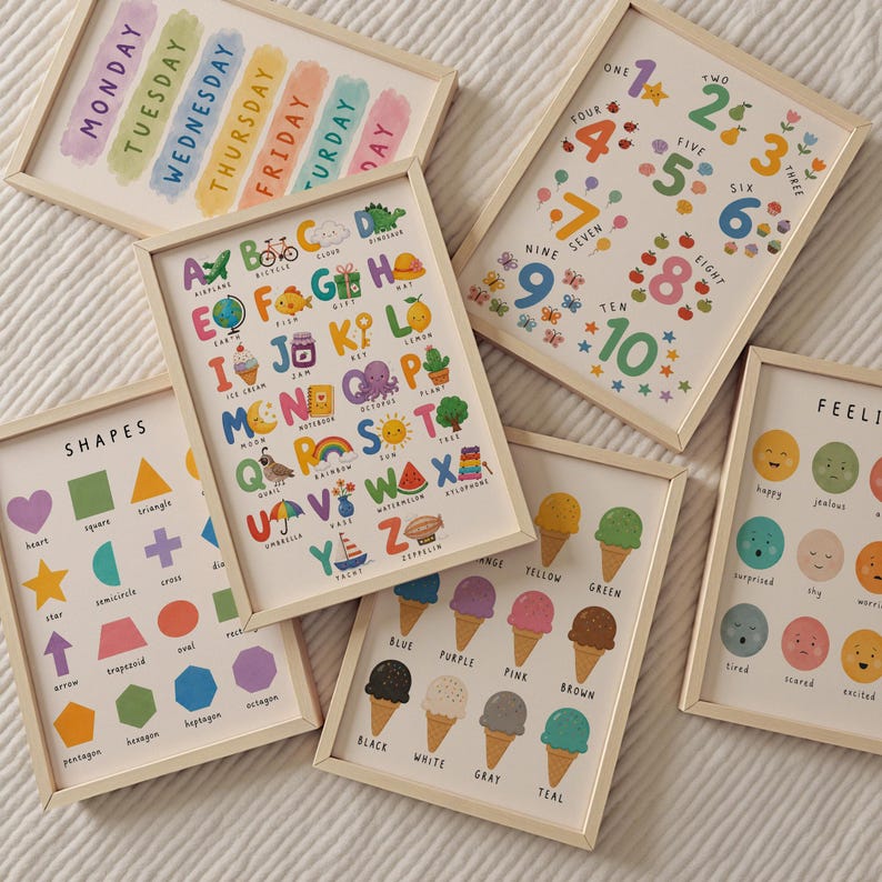 May include: A collection of framed educational prints. The prints feature colorful illustrations of the alphabet, numbers, shapes, days of the week, ice cream flavors, and emotions. Each print is in a light wood frame.