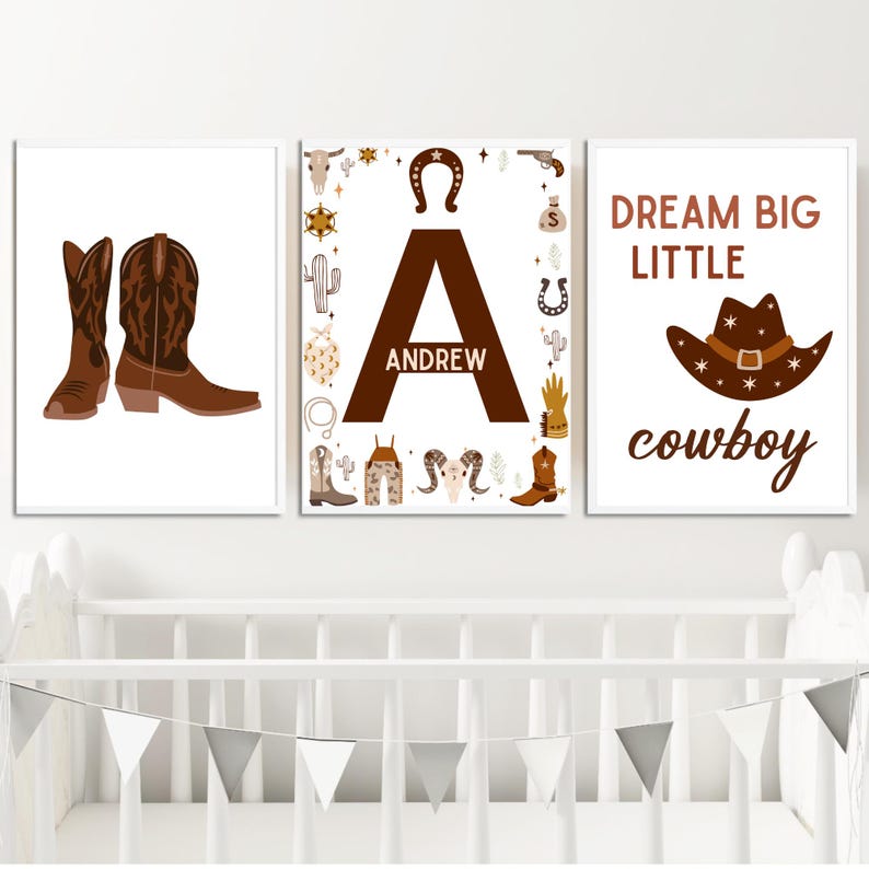 May include: Three brown and white nursery prints with a cowboy theme. The first print features a pair of brown cowboy boots. The second print features the letter A with the name Andrew written inside. The third print features a brown cowboy hat with the text "Dream Big Little Cowboy".