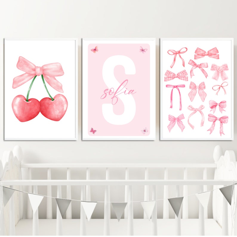 May include: Three pink and white nursery prints with a pink bow and cherries, a pink letter S with the name "sofia" and a collection of pink bows.