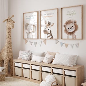 May include: Three framed prints with animal illustrations and inspirational quotes. The prints feature a zebra, an elephant, and a lion. The quotes are "You are loved beyond measure", "I am fearfully and wonderfully made", and "You are a child of God".