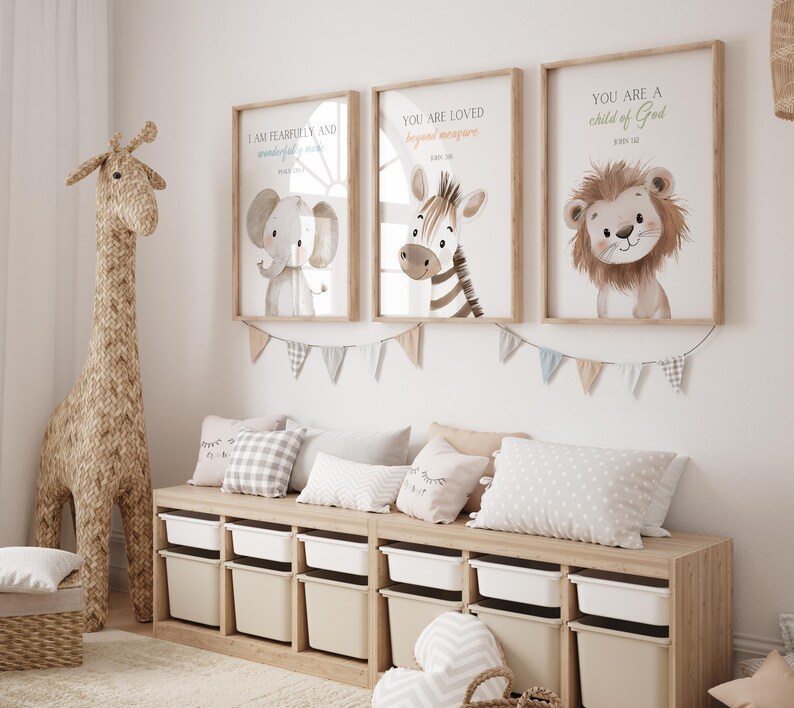 May include: Three framed prints with animal illustrations and inspirational quotes. The prints feature a zebra, an elephant, and a lion. The quotes are "You are loved beyond measure", "I am fearfully and wonderfully made", and "You are a child of God".
