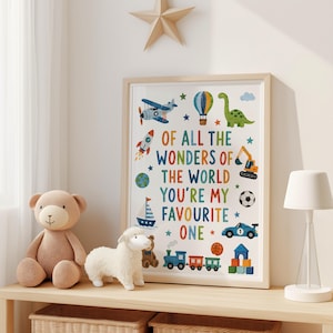 May include: A framed wall art print featuring the text OF ALL THE WONDERS OF THE WORLD YOU'RE MY FAVOURITE ONE surrounded by colorful illustrations of an airplane, hot air balloon, dinosaur, rocket, globe, sailboat, excavator, soccer ball, car, train, and blocks.