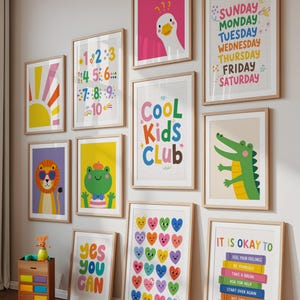 May include: A collection of framed art prints with colorful illustrations and motivational quotes. The prints feature a variety of designs, including a sun, a lion, a frog, a crocodile, hearts, and the text "Cool Kids Club".