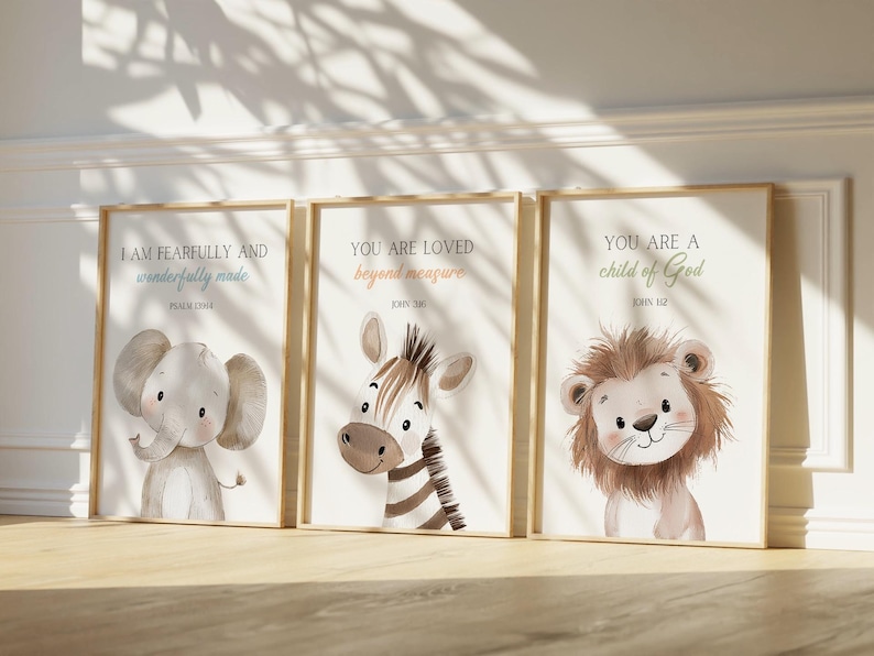 May include: Three framed prints with inspirational quotes and animal illustrations. The prints feature a brown elephant, a zebra with black and white stripes, and a brown lion. The quotes are "I am fearfully and wonderfully made", "You are loved beyond measure", and "You are a child of God".