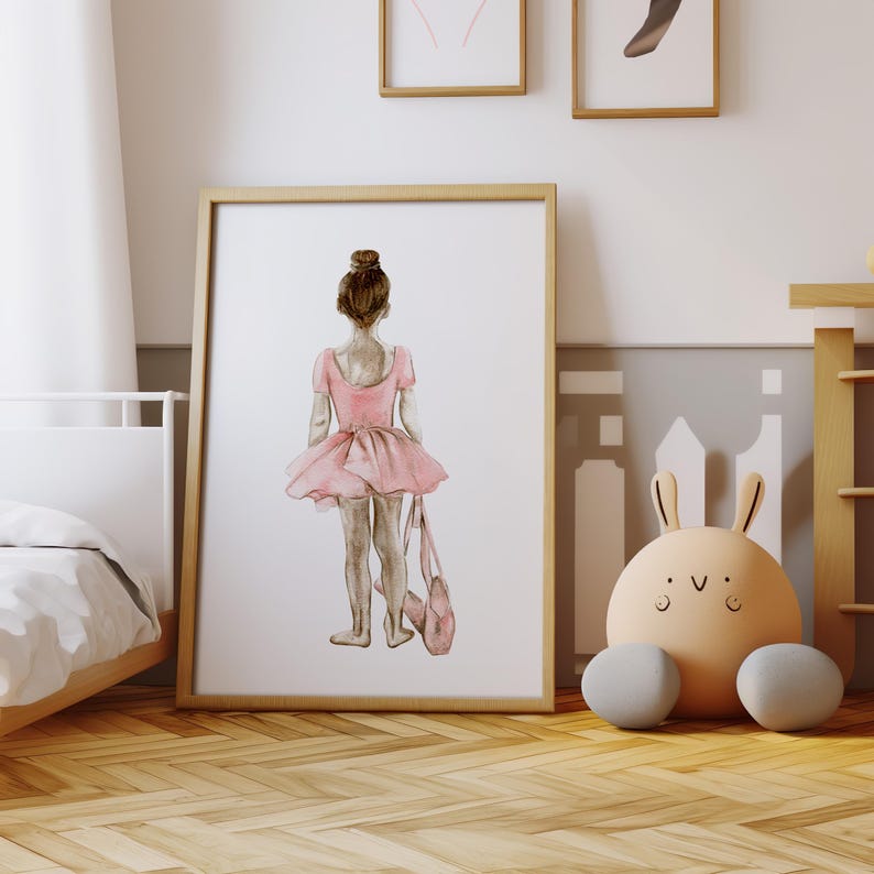 May include: A watercolor illustration of a young ballerina wearing a pink tutu and holding a pink ballet bag. The ballerina is facing away from the viewer and has her hair pulled back in a bun.