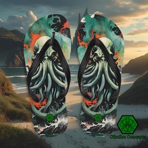 May include: Pair of flip-flops featuring a Cthulhu design. The sandals have a black strap and a colorful graphic of the mythical creature with red eyes, tentacles, and a green and orange background. The flip-flops are on a sandy beach.