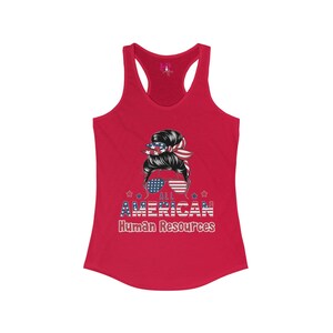May include: A red tank top with a racerback design. The front features a graphic of a woman with sunglasses and a patriotic bandana. The text "ALL AMERICAN Human Resources" is displayed below the graphic in red, white, and blue.