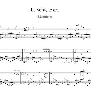 May include: Sheet music for "Le vent, le cri" by E. Morricone. The musical score is written in black ink on white paper, featuring treble and bass clefs, with notes and musical symbols. The title and composer's name are at the top.