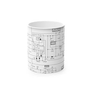 May include: White ceramic mug with a black and white schematic diagram printed on its surface. The diagram includes text such as "Low Scale Heater Res" and "SK/B Heater Adjust". A distinctive gift for those interested in electronics.