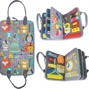 May include: A set of three grey fabric quiet books with various textures and activities for children. The first book features a woodland animal theme with a zipper, buttons, and a flap. The second book has a colourful geometric theme with a zipper, buttons, and a flap. The third book has a clock, a buckle, and a zipper.