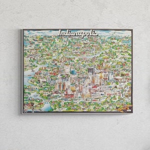 May include: A framed illustration of a city map of Indianapolis, Indiana. The map is drawn in a cartoon style with colorful buildings and landmarks. The title "Indianapolis" is printed at the top of the map.