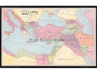 May include: A framed historical map titled A General Map of Bible Lands, featuring pastel-colored regions including Asia Minor, Egypt, and Syria. The map displays geographical labels in black text, surrounded by a dark wood-toned frame border.