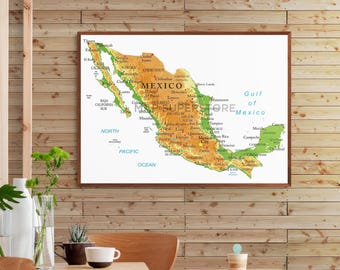 May include: A physical map of Mexico displayed in a brown wooden frame. The map features a topographic color scheme with orange and green terrain, clearly labeling major cities, states, the Gulf of Mexico, and the North Pacific Ocean in blue text.