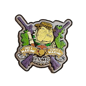 May include: A pin featuring a bulldog wearing a hat and holding a rifle, with the text "Once a Marine, Always a Marine" and "USMC". The pin has a silver border and purple rifles.