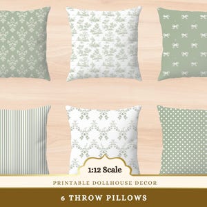 May include: Six decorative throw pillows with various patterns, including floral, bow, striped, and polka dot designs. The pillows are in shades of green and white, suitable for dollhouse decor. The text at the bottom reads "6 Throw Pillows".