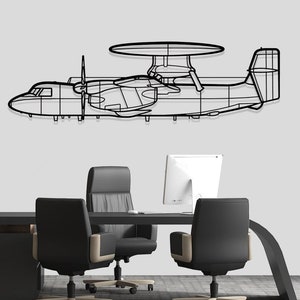May include: A black metal wireframe model of a plane with a propeller and a radar dish on top, hanging on a white wall above a black desk with three black office chairs.