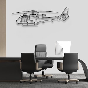 May include: Black metal wall art depicting a helicopter in flight. The helicopter is shown against a white wall with a desk and chairs in the foreground.