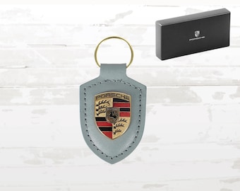 Porsche-sleutelhanger: schaduwgroen leer, gouden embleem