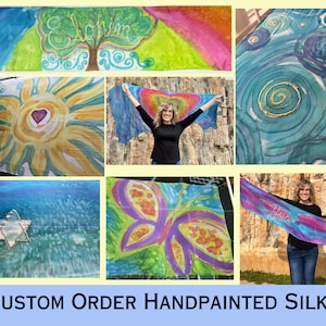 May include: Custom hand-painted silk scarves featuring a variety of designs, including a butterfly, a sun, a Star of David, and a tree with the word "Elohim" written on it. The scarves are shown against a white backdrop.