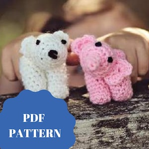 May include: A crochet pattern for making two small stuffed animals. One is a white dog and the other is a pink pig. The pattern is available as a PDF download.