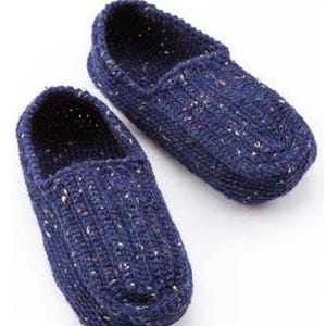 May include: A pair of blue crocheted slippers with a speckled pattern.