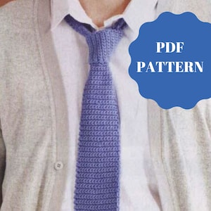 May include: A purple crocheted tie, worn with a white shirt and a light gray cardigan. The image includes the text "PDF PATTERN".