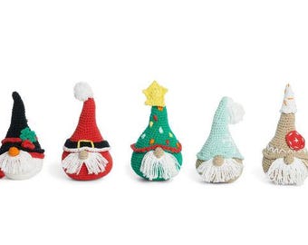 May include: Five crocheted gnomes with different colored hats and beards. The gnomes are wearing red, green, black, blue, and brown hats. They are all standing on a white surface.