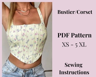 May include: A light yellow bustier/corset with a floral pattern of pink and purple flowers. The top has a square neckline and thin straps. The image also includes the text "PDF Pattern XS - 5 XL" and "Sewing Instructions".