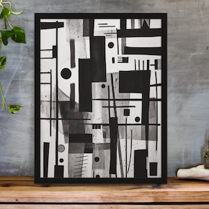 Puede incluir: Impresión de arte geométrico abstracto en blanco y negro en un marco negro. La impresión presenta una variedad de formas y líneas, creando un diseño moderno y minimalista.