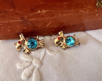 Gold toned Scottie dog pins/brooches with a blue rhinestone on the belly.  These scatter pins may be sold together or separately.