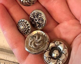 Lot of 5 vintage metal floral buttons in silver tones.