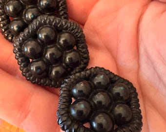 Three antique black buttons of hard plastic, Victorian/turn of the century, outerwear buttons
