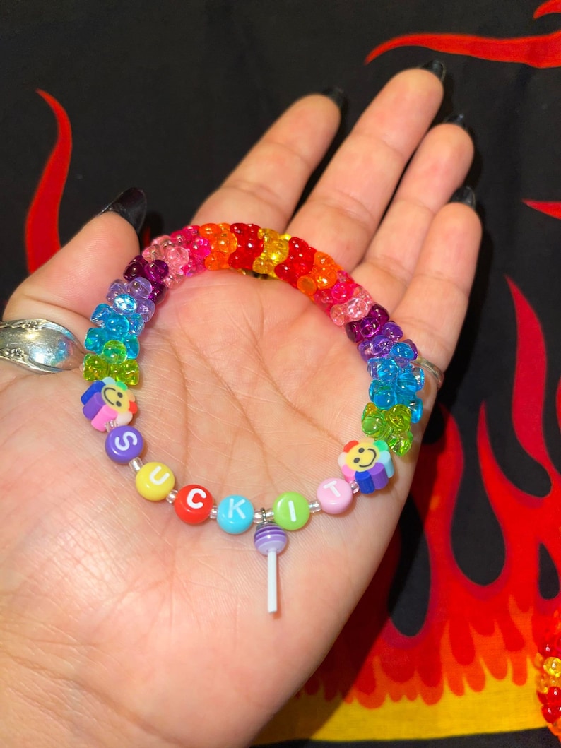 "suck it" kandi rainbow bracelet with tribeads and purple sucker charm