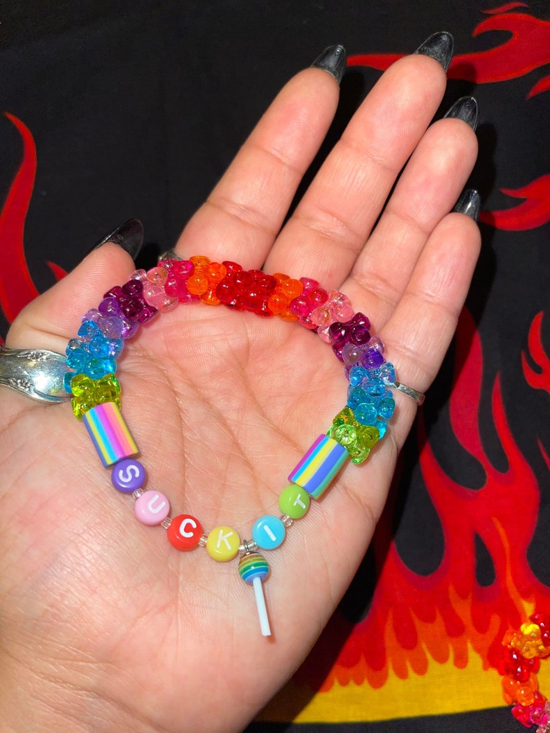 "suck it" rainbow kandi bracelet with tribeads and rainbow sucker charm