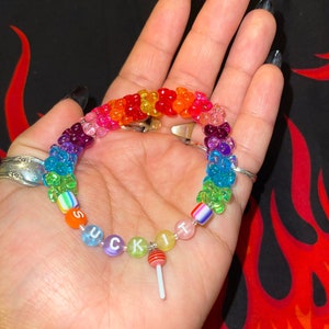 "suck it" rainbow kandi bracelet with tribeads and red sucker charm