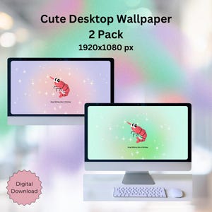 May include: Two computer monitors displaying a cute desktop wallpaper featuring a cartoon shrimp with the text "Stop Sitting Like A Shrimp." The wallpaper has a pastel color scheme with sparkling accents. The image also includes the text "Cute Desktop Wallpaper 2 Pack 1920x1080 px."
