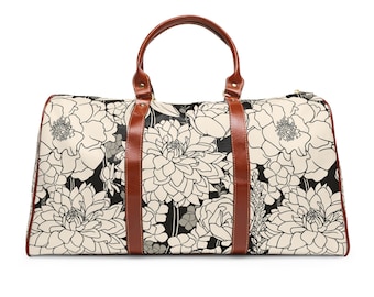 Bolsa de viagem à prova d'água com design floral preto e branco, alças de couro sintético marrom, alça de ombro