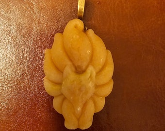 Orange Jade nine tailed fox pendant on adjustible length silk cord.