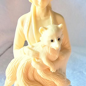 Ivory Tagua Nut carved Lady/Goddess holding Nine Tailed Fox.