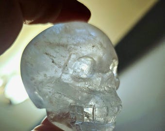 Skull carving of Indonesian clear quartz. Hand carved, one of a kind sculpture.