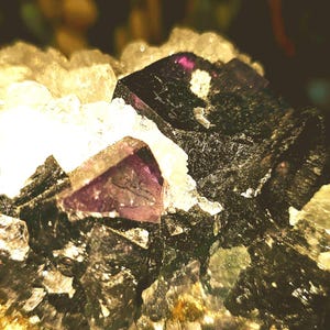 Sunlight Fluorite mined in inner Mongolia. Deep dark purple changes color in the sun.